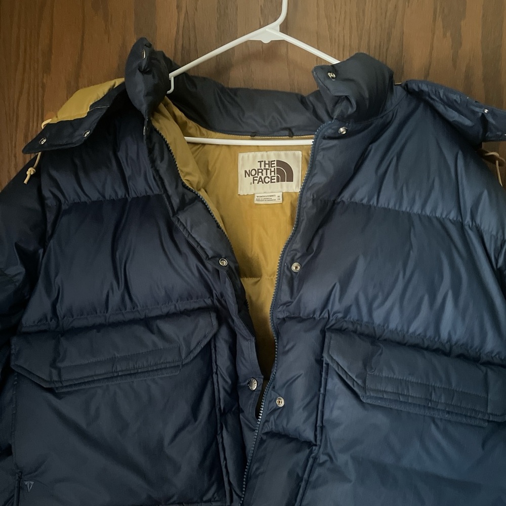 Navy blue The North Face puffer coat.